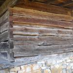 Here's a close-up view of the back, second story. Notice the big gap between the third and fourth logs. Also notice the little door and the porch that's just laying there.