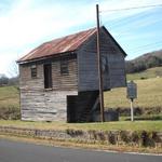 ...and the view from the other side. That lighter wood (from the door to the ground) is a fairly recent addition.